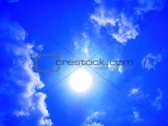 Blue sky with clouds and sun