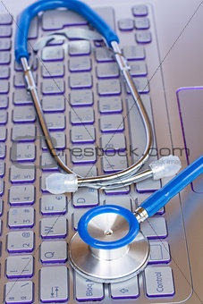 stethoscope on notebook keyboard
