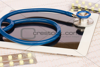  stethoscope with medical tablet and pills