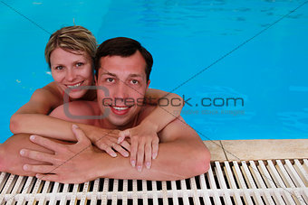 loving couple in the water pool