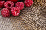 Fresh Ripe Sweet Raspberry on Wooden Background
