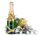 Champagne bottle, christmas gift and snowy firtree