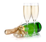 Champagne bottle with christmas decor and two glasses