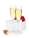 Champagne glasses, empty card and gift