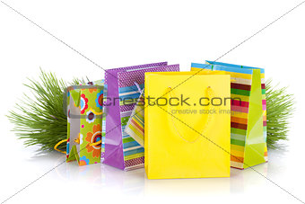 Colorful gift bags with christmas gifts