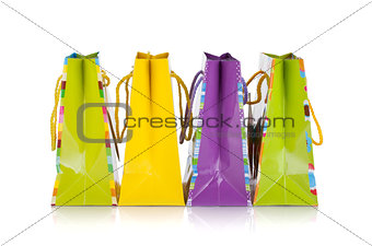 Four colored gift bags