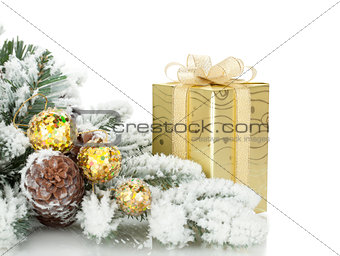 Gift box, christmas decor and snowy fir tree