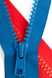 Blue and red zippers closeup