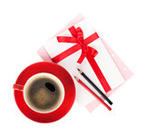 Red coffee cup and love letter with bow