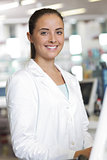 Portrait of Smiling Woman Pharmacist in Pharmacy