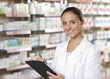 Portrait of Smiling Woman Pharmacist whit clipboard