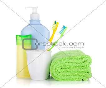 Toothbrushes, cosmetics bottles and towel