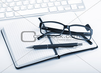 Glasses and office supplies