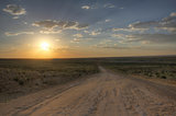 Sunset over dirt road leading to Chaco Culture National Park