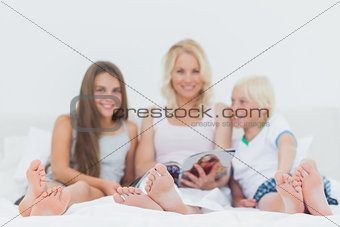 Portrait of a family reading a magazine