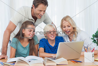 Parents and children using a computer