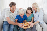 Family eating pizza together