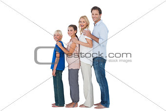 Family posing together and looking at camera