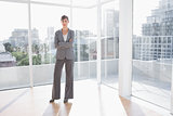 Businesswoman standing in bright office