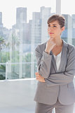 Thoughtful businesswoman standing