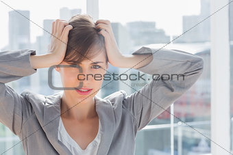 Frustrated businesswoman looking at camera