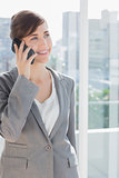 Businesswoman on the phone and smiling