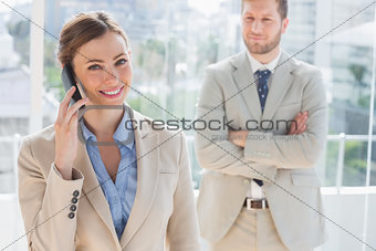 Happy businesswoman having phone conversation