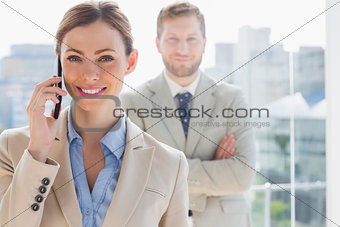 Smiling businesswoman having phone conversation