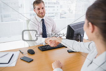 Businessman shaking hands with a colleague