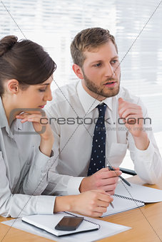 Business people discussing documents