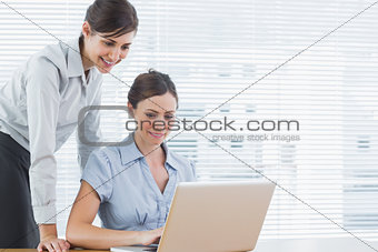 Businesswomen looking at a laptop