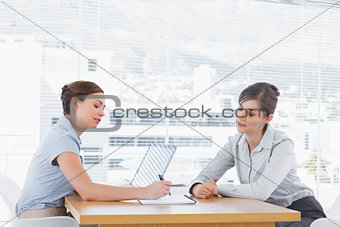 Businesswomen having a meeting at desk