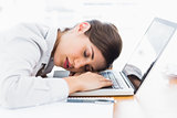Pretty businesswoman sleeping at her desk