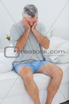 Man getting off the bed