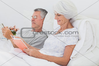 Couple reading together in bed