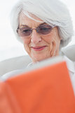Retired woman reading a book