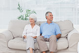 Elderly couple sitting on sofa
