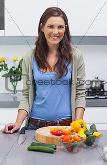 Attractive woman standing in her kitchen