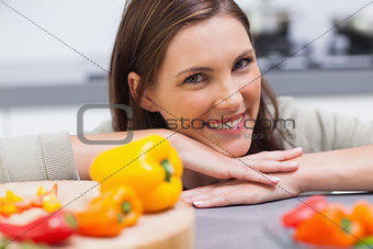 Woman leaning on the counter  of her kitchen