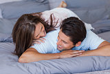 Couple having fun on the bed