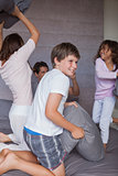 Happy family having a pillow fight on the bed