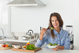 Woman eating a vegetarian salad