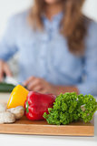 Chopping board with vegetables on a table