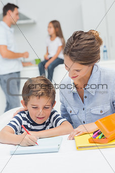 Mother drawing with her son