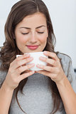 Woman waking with the scent of coffee