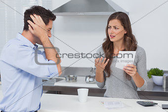 Angry couple doing their accounts