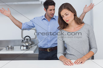Man gesturing to wife during a dispute
