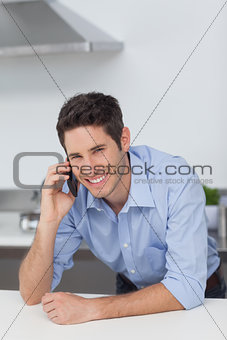 Man phoning in the kitchen
