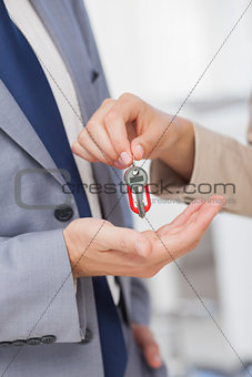 Woman giving key