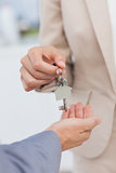 Estate agent giving house key